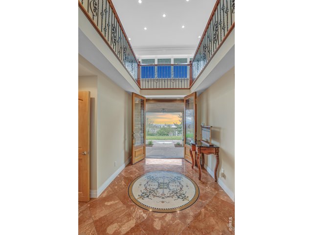 Property Photo 7 A grand entryway welcomes you into the home. 