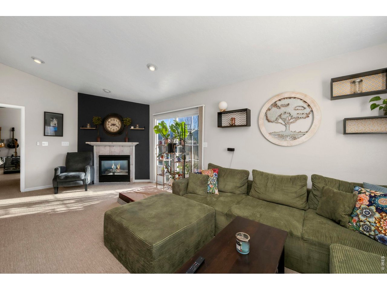 Livingroom has ample natural light and a gas fireplace!