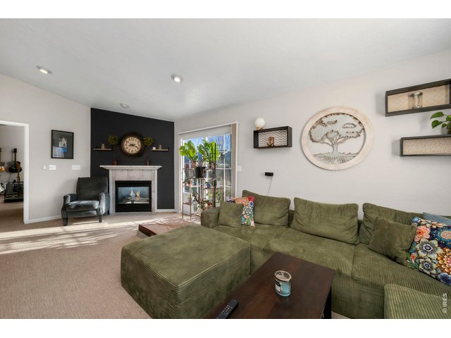Property Photo 6 Livingroom has ample natural light and a gas fireplace!