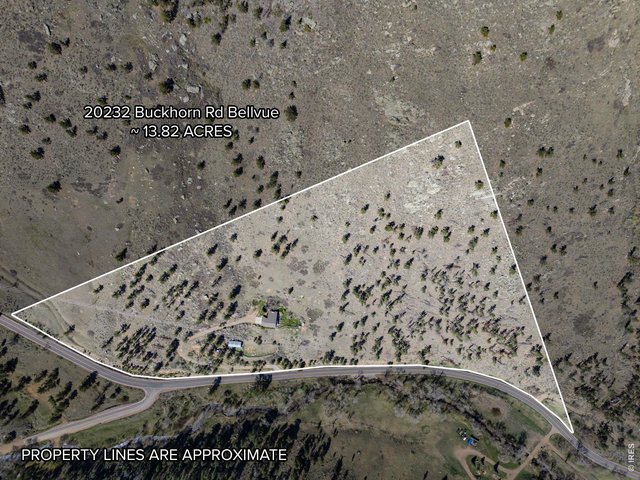 Property Photo 4 Situated on 13.82 acres of dispersed ponderosa pines. Beautiful terrain.