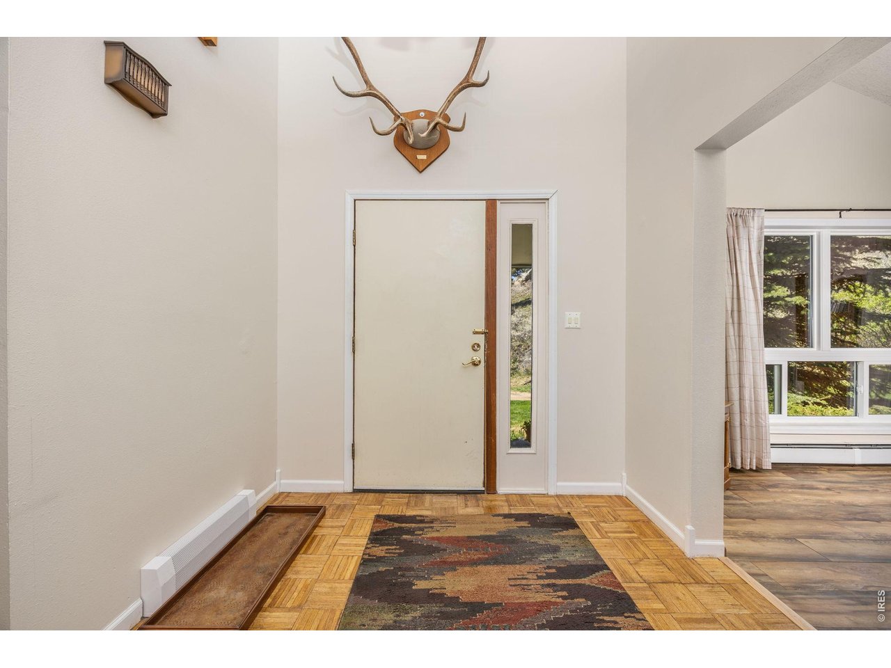 Inside, enjoy an open, light-filled layout with vaulted ceilings, large windows, and a cozy wood-burning fireplace. 