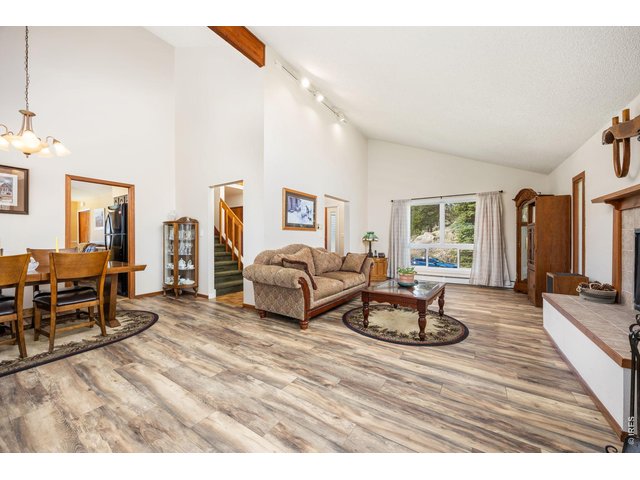 Property Photo 12 The expansive family room offers comfort and mountain views.