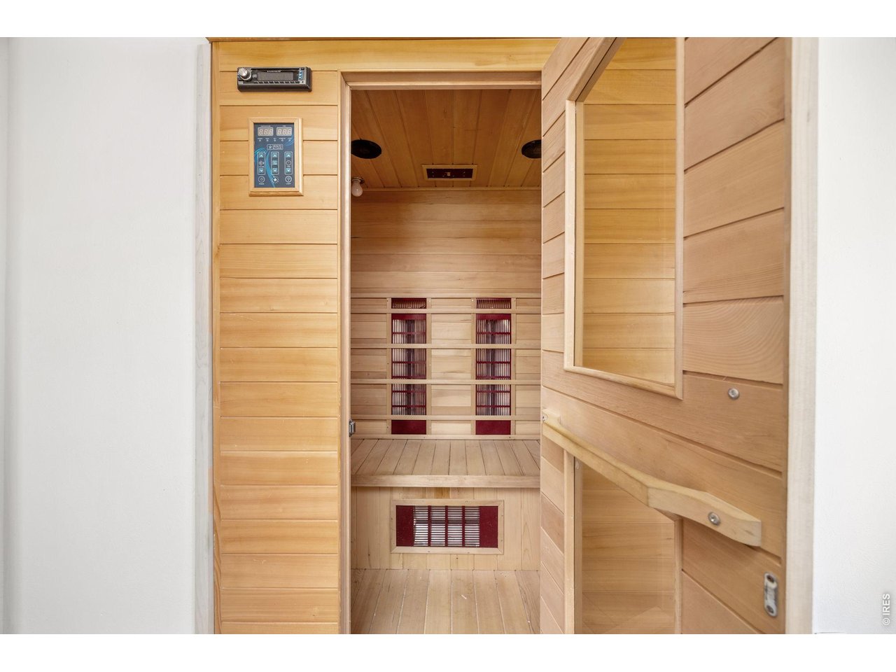 The walk-out basement includes a custom workshop, bonus room (perfect for an office or gym), walk-in sauna, storage, and space to expand.