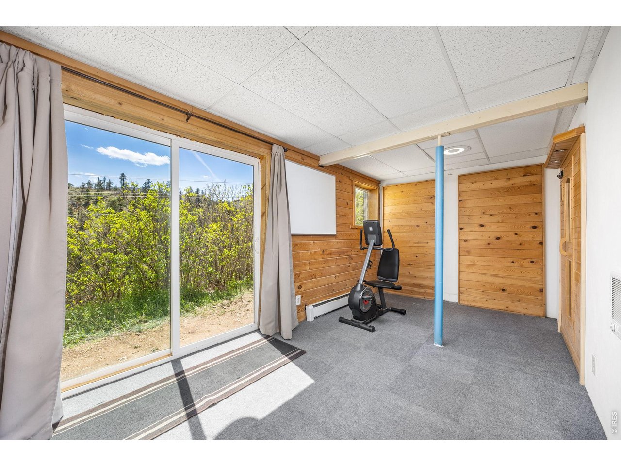 The walk-out basement includes a custom workshop, bonus room (perfect for an office or gym), walk-in sauna, storage, and space to expand.