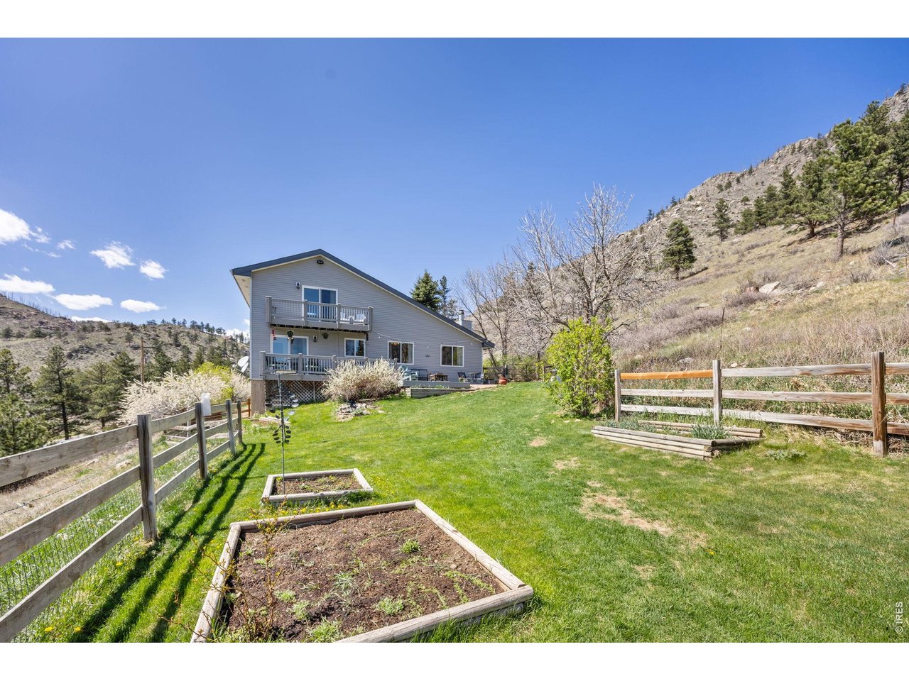  Outside, enjoy a 720 sq ft barn, three sheds (including one suitable as a chicken coop), mature irrigated landscaping, garden beds, and a water feature
