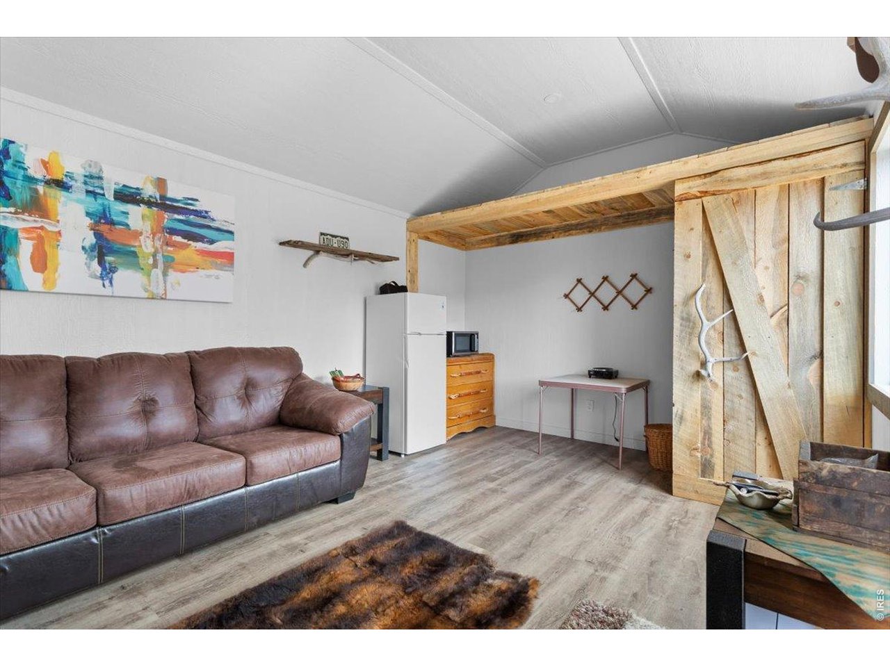 Creative storage area, with small composting toilet behind door on right 