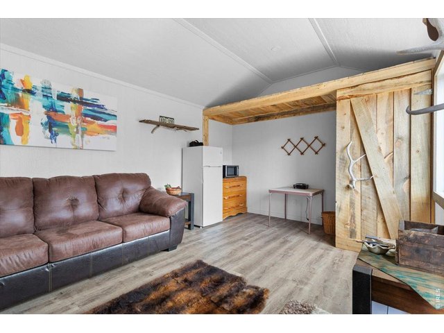 Property Photo 6 Creative storage area, with small composting toilet behind door on right 