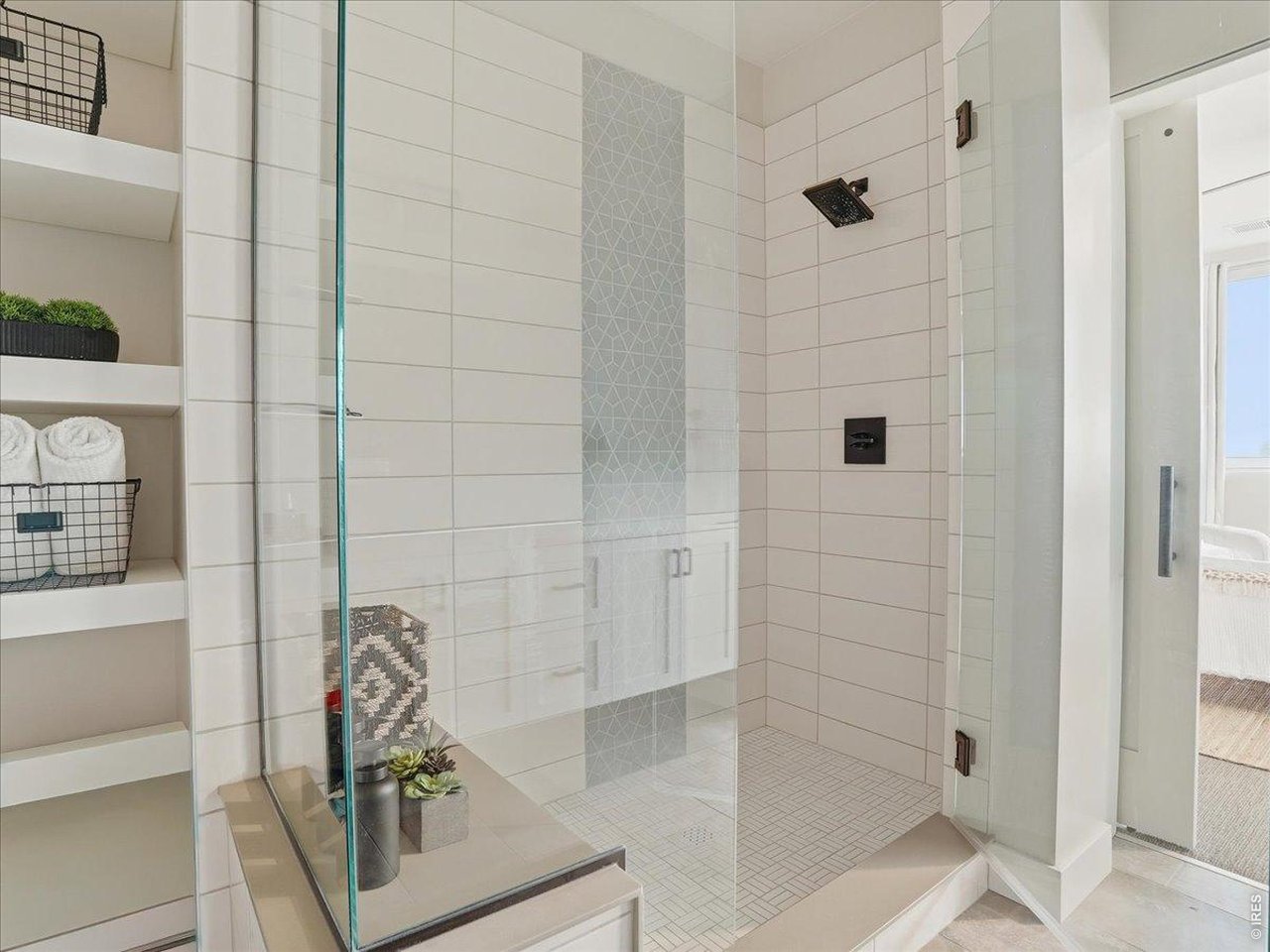 Spacious glass walk-in shower.