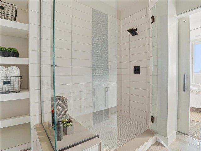 Property Photo 14 Spacious glass walk-in shower.