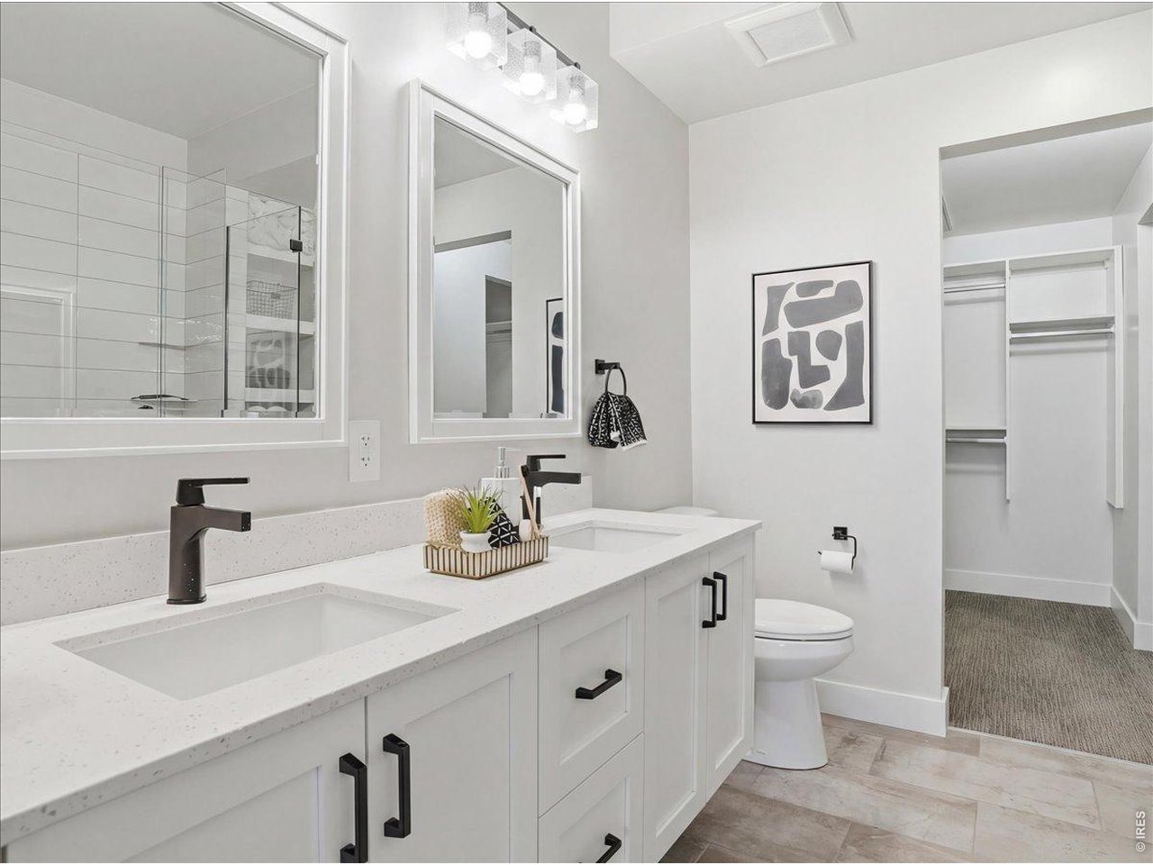 Spacious Walk in Closet with built in shelving. Washer/Dryer located in area off closet.