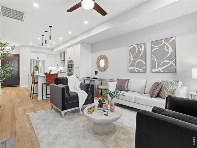 Property Photo 10 Bright, open living area designed for both comfort and style.