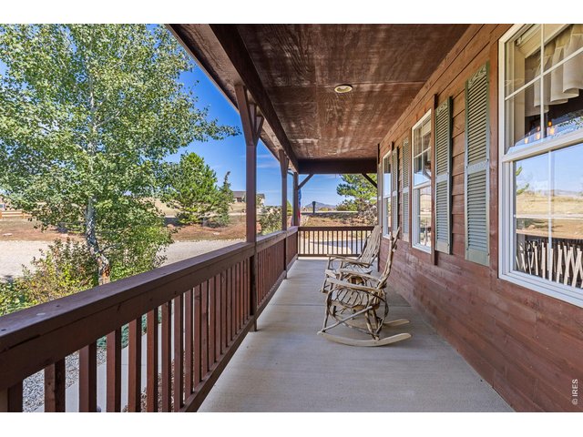 Property Photo 6 Relax and take in the views and amazing sunsets from the traditional front porch.