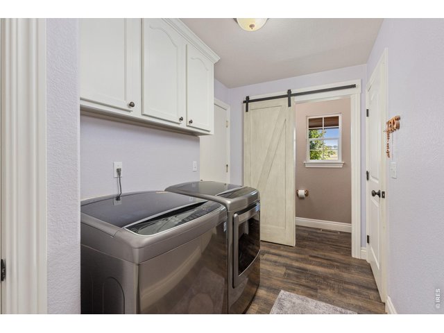 Property Photo 22 Main Floor Laundry is just off the 3 Car Garage heading into the Kitchen