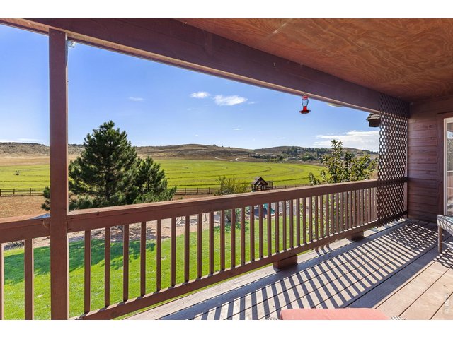 Property Photo 32 Large Covered Deck off the Back of the Home for Entertaining and Taking in the Views and Sunrises to the East