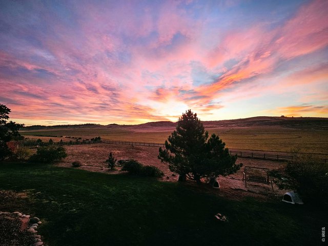 Property Photo 38 Seller Provided Photo of one of the Amazing Sunrises from the Property