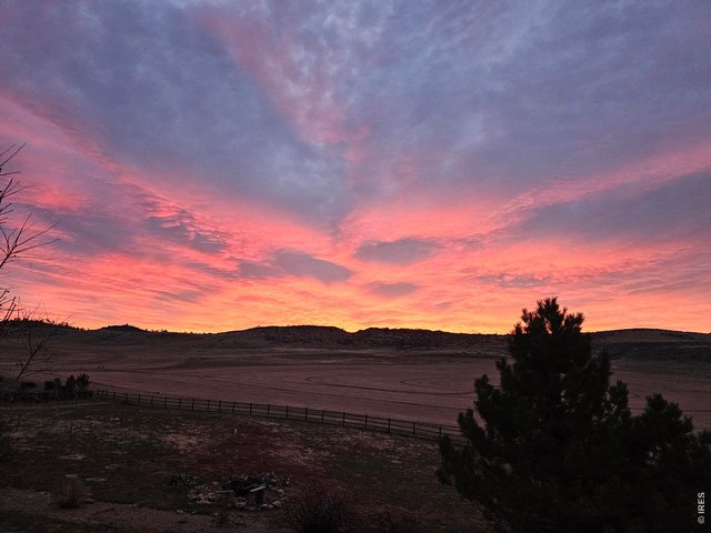 Property Photo 39 Seller Provided Photo of one of the Amazing Sunrises from the Property