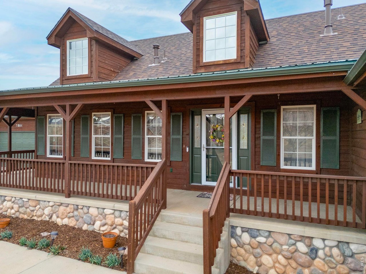 Large inviting front porch is perfect for relaxing on and taking in the western views.