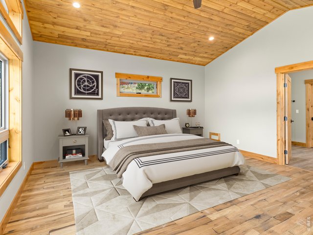 Property Photo 23 Hardwood flooring and vaulted ceiling