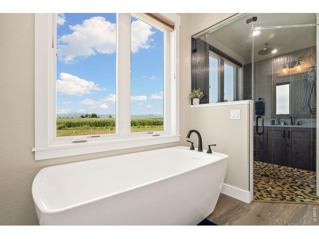 Property Photo 30 This 5-piece bathroom is a wonderful place to get away and relax with a soak in the tub, or time in the steam shower!