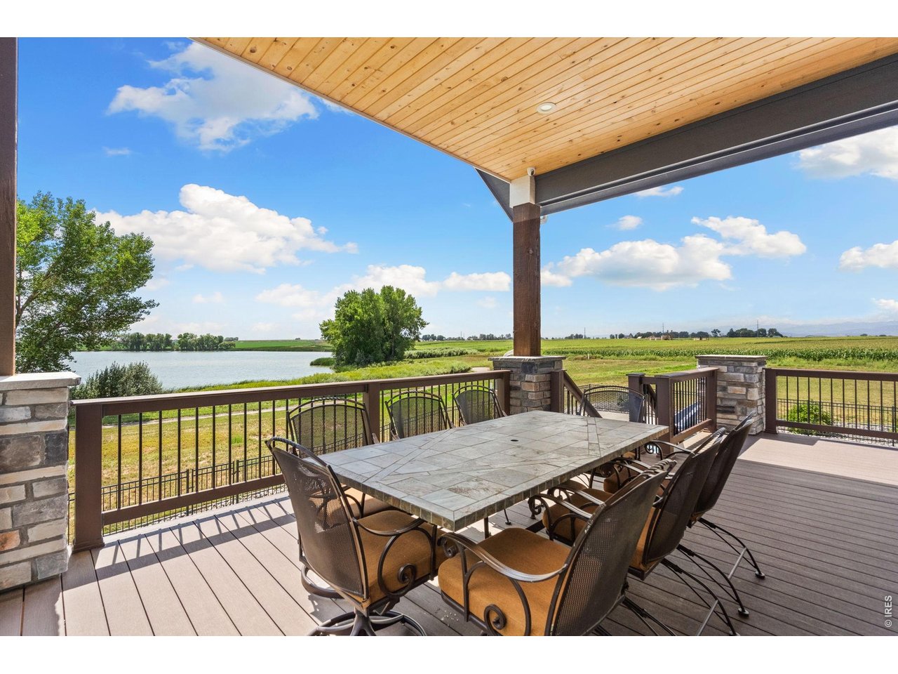 Enjoy full lake and mountain views from the upper covered deck.