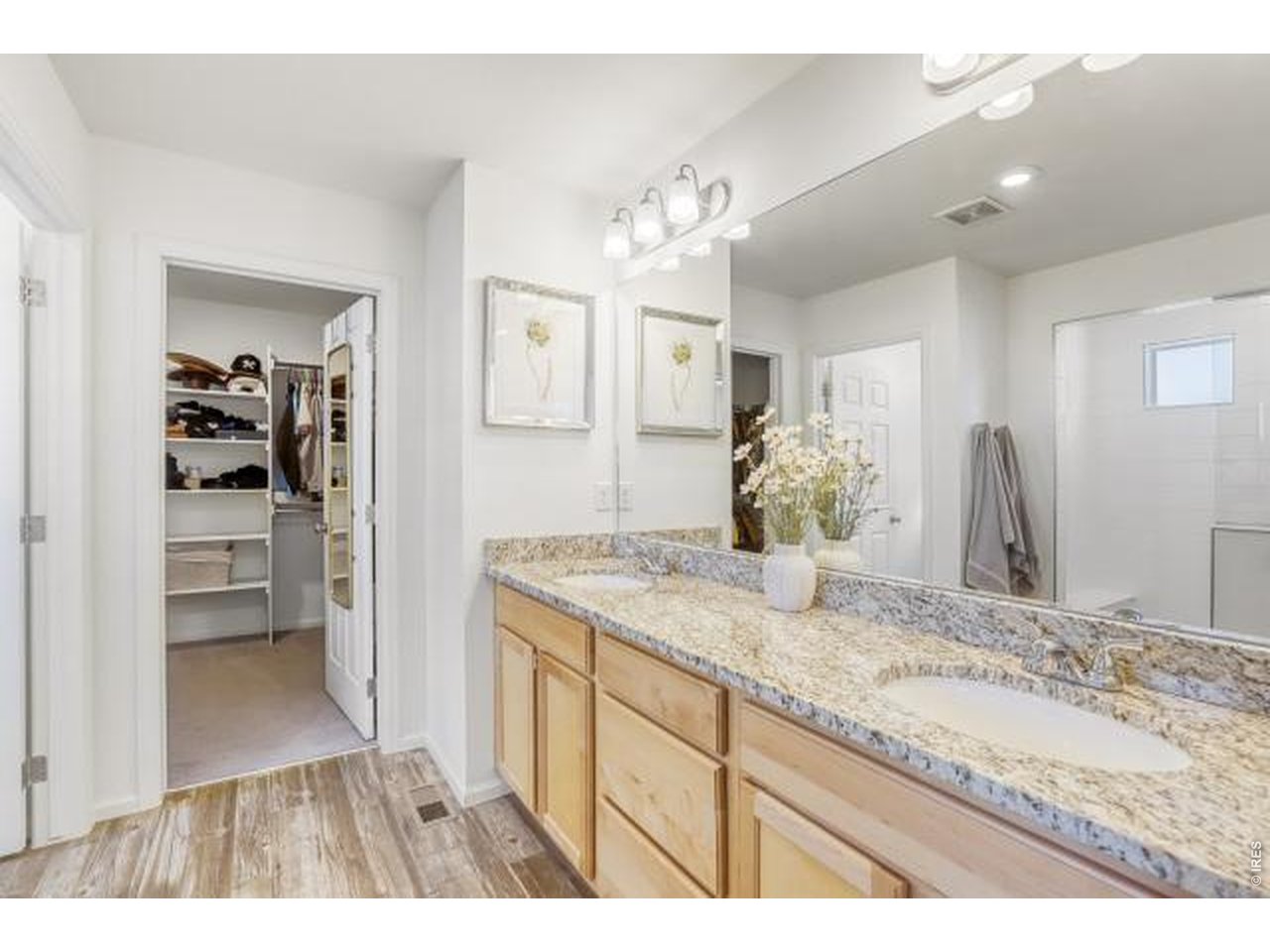 Double sink vanity in Primary bath with attached walk-in closet