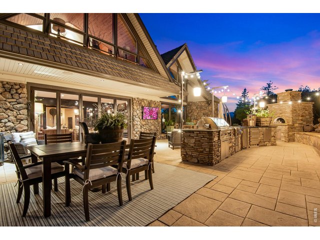 Property Photo 12 Step outside onto the patio to barbeque, cook a pizza in the pizza oven, laugh, lounge, and watch TV next to the pond and numerous water features