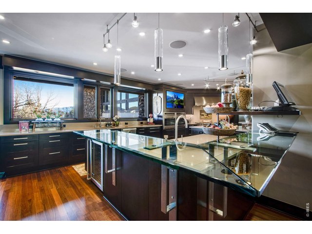 Property Photo 16 The gourmet kitchen is a culinary delight, equipped with custom Irpina cabinets, Sub-Zero Pro Package, 2 Wolf ovens and gas cook-top, 2 warming drawers and 2 Miele Dishwashers.
