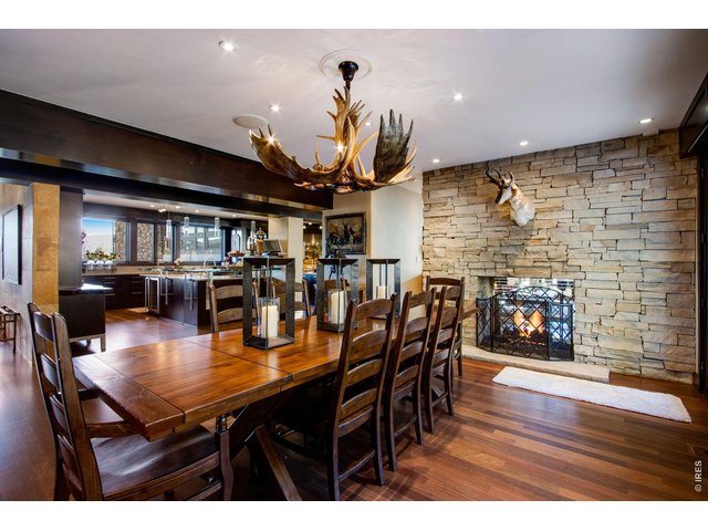 Property Photo 17 A grand formal dining room is easily accessible from the kitchen. Large windows allow one to look upon the water features outside.