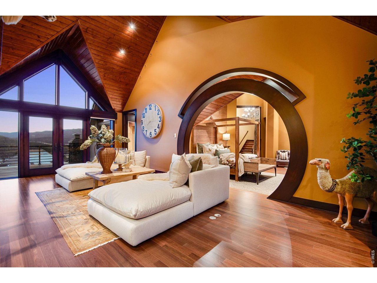 Relax by the fire, read, or watch television in this sitting area. A huge primary walk-in closet and laundry room are also connected to it.