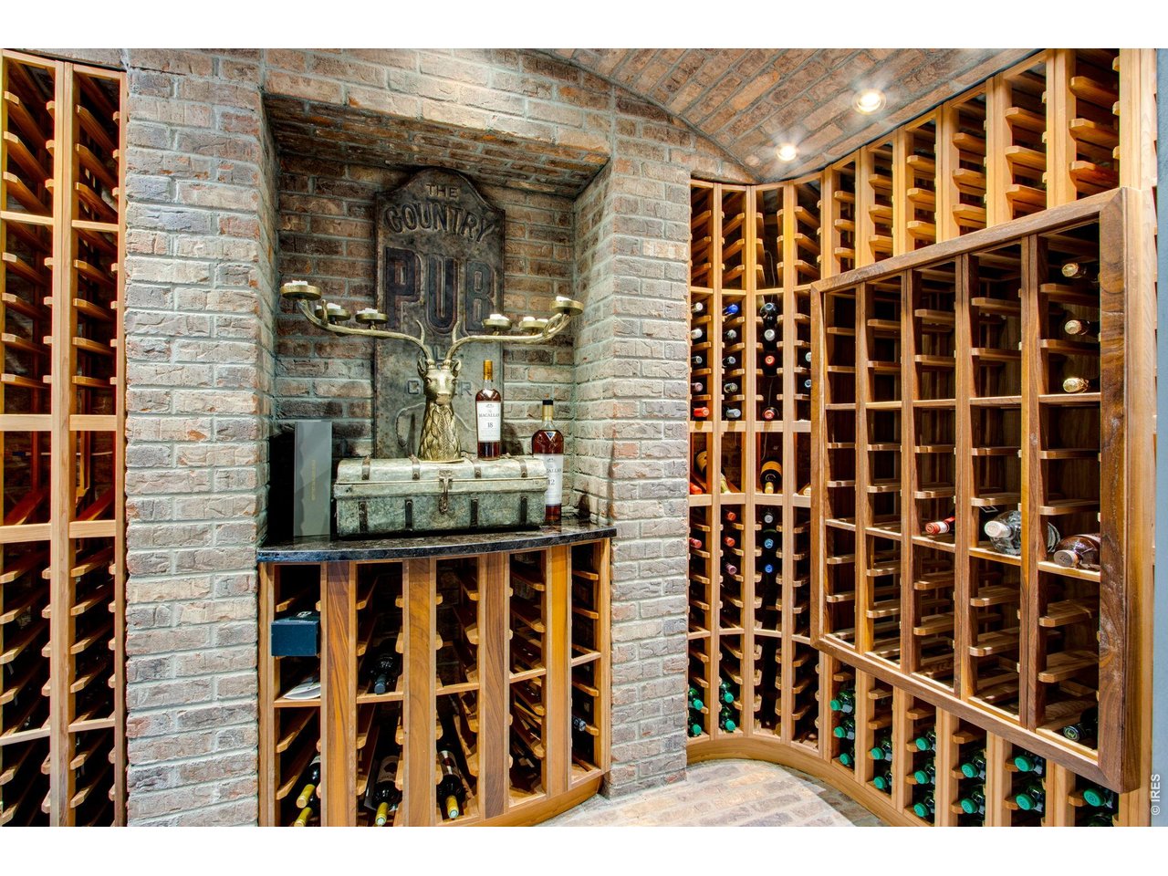 A stone, walk-in wine cellar provides plenty of space for your collection.
