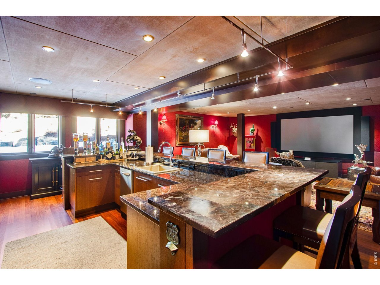This formal bar and theater room is one of a kind.