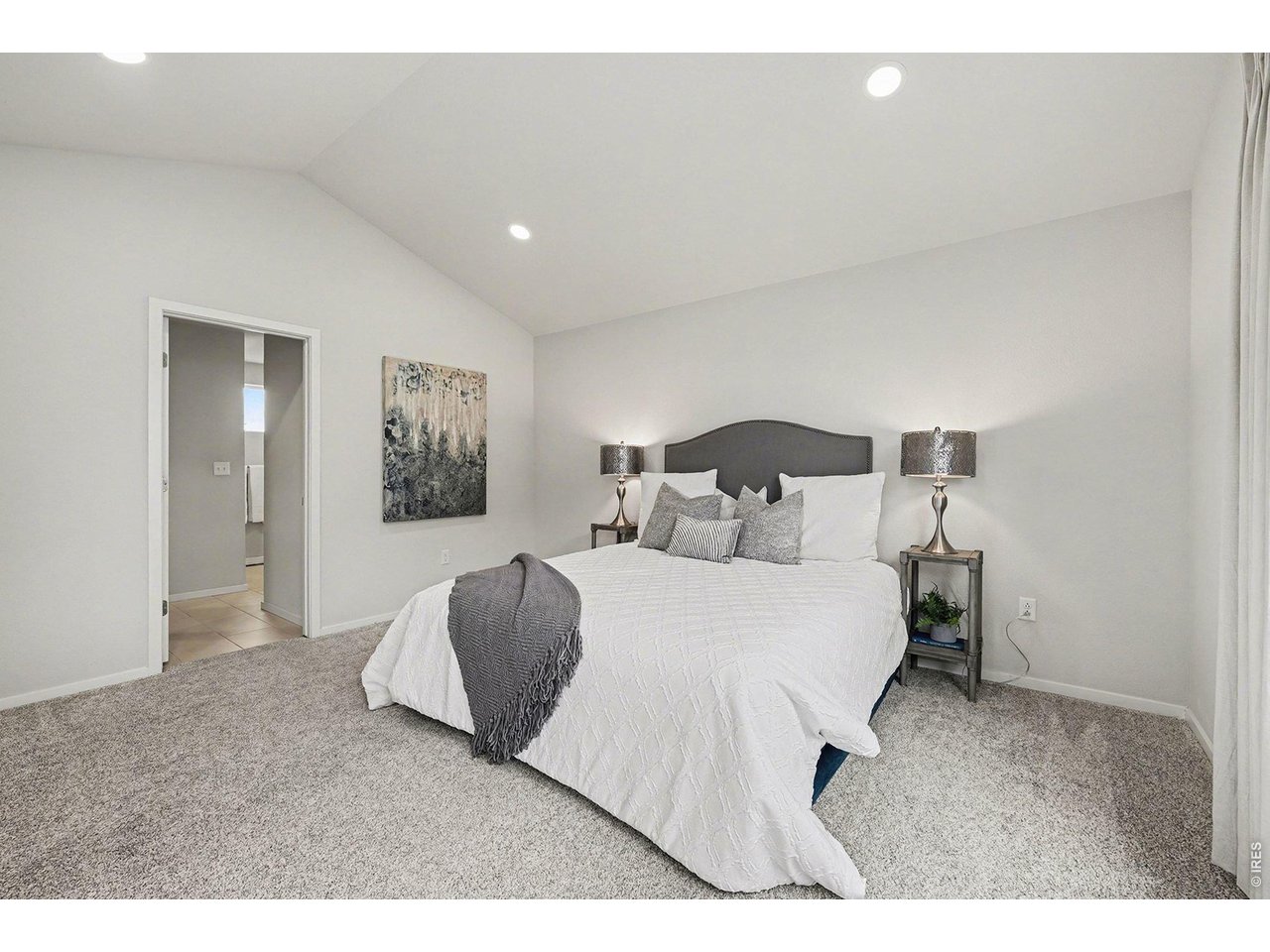 Primary suite with vaulted ceilings