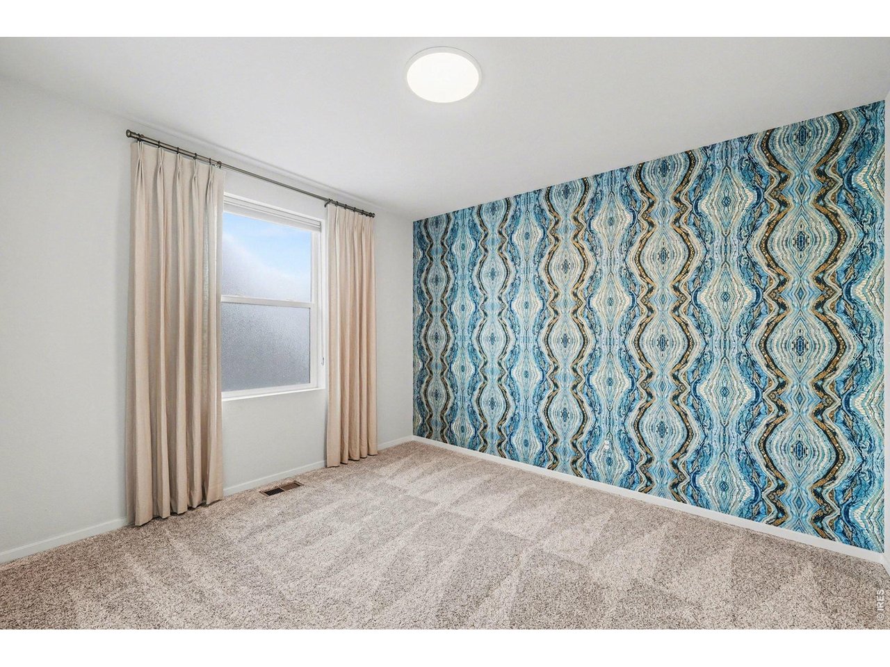 3rd upstairs bedroom... Statement wall and natural light