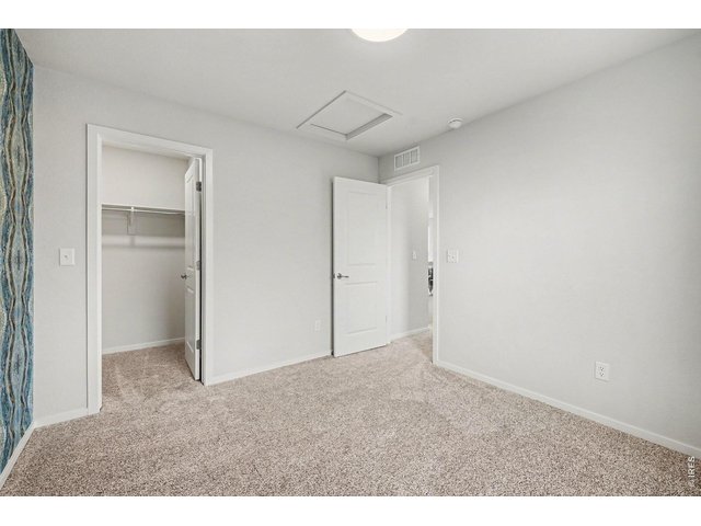 Property Photo 23 3rd upstairs bedroom w/walk in closet