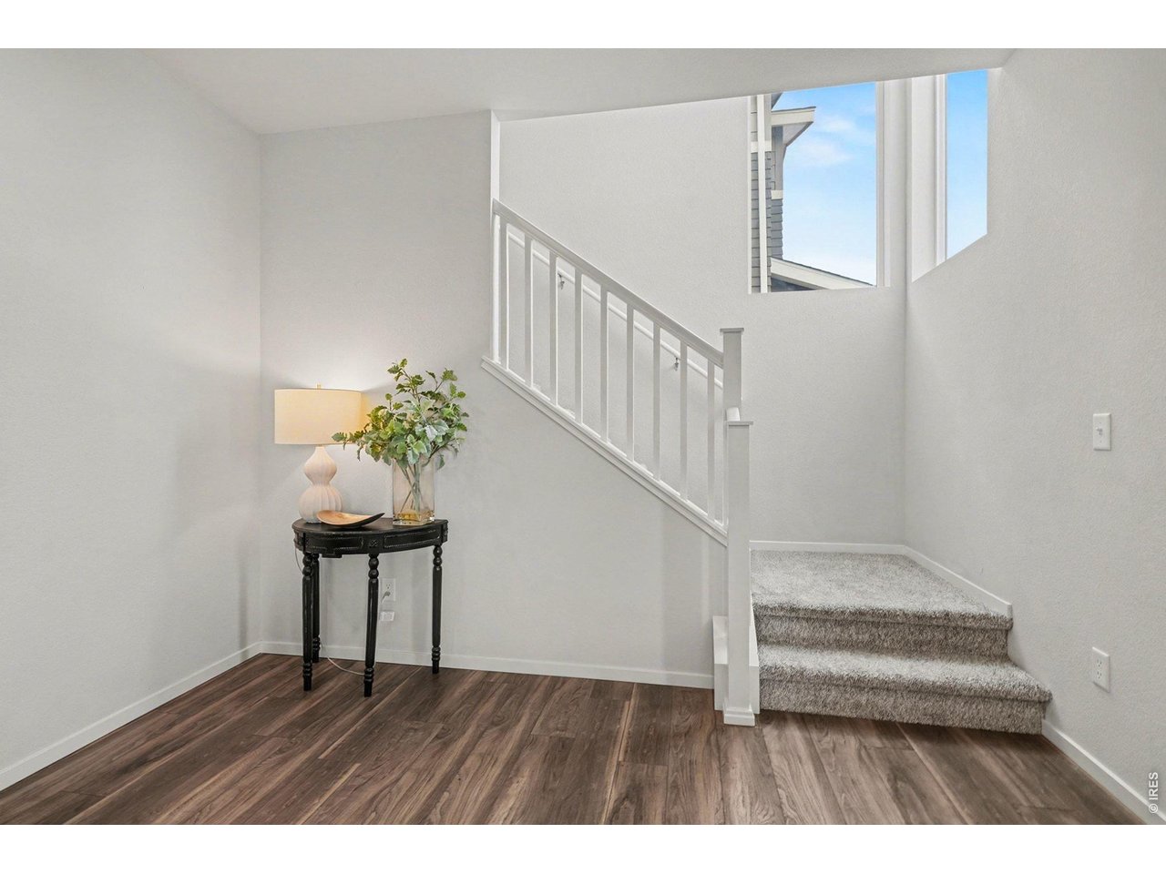 Modern simplicity meets cozy comfort in this sun-drenched entryway