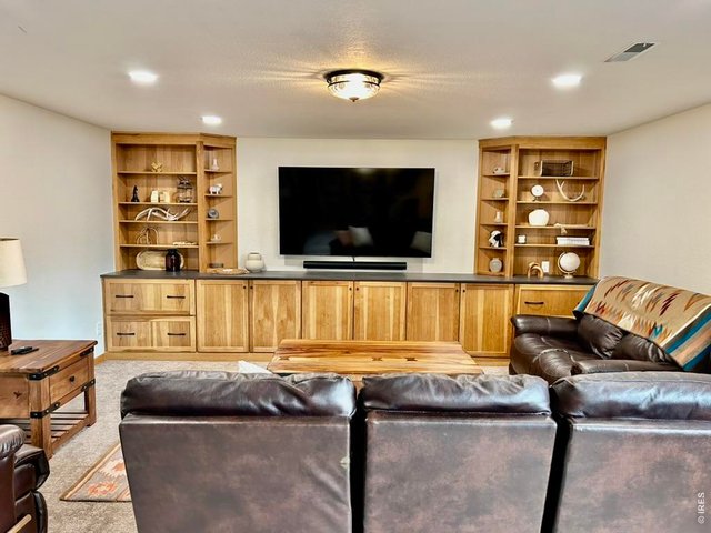 Property Photo 34 Cozy Gathering Area In Basement Family Room