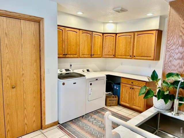 Property Photo 22 Nice Size Main Floor Laundry Room With Lots of Storage