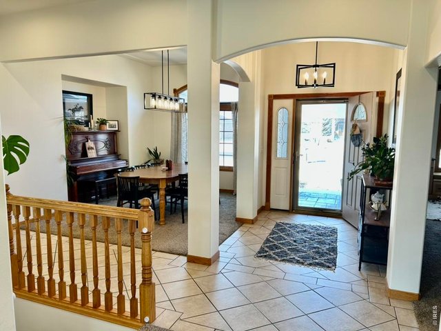 Property Photo 12 View of Formal Dining And Entry Foyer