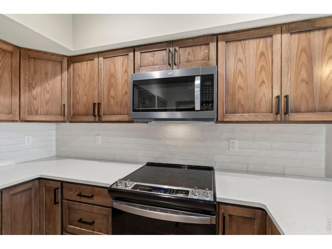 Property Photo 7 Tiled backsplash and new appliances.