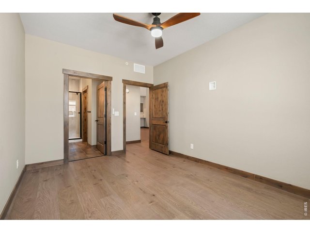 Property Photo 22 Main level primary suite with walk in closet.