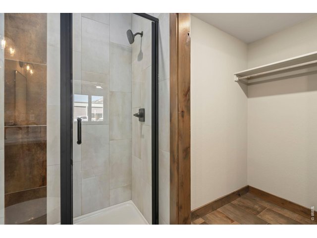 Property Photo 24 Main level walk in closet and glass shower