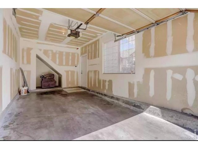 Property Photo 11 Attached one car garage with extra storage space.
