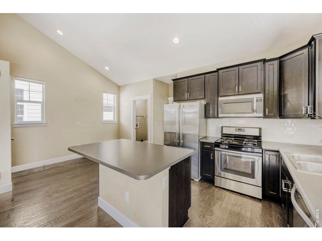 Property Photo 6 Gourmet island kitchen with stainless steel cabinets and a gas stove. 