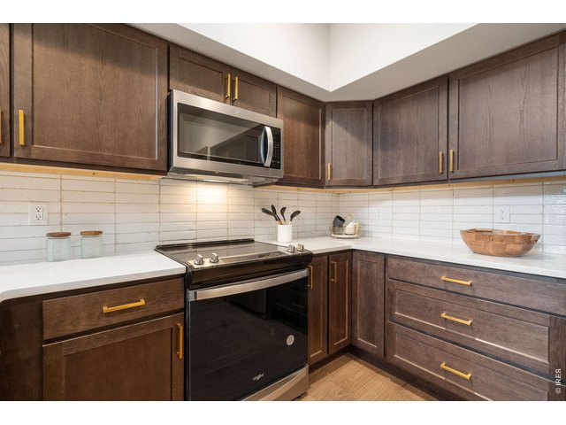 Property Photo 14 Stainless steel appliances and tile backsplash