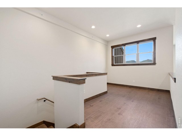 Property Photo 22 Upstairs loft, perfect flex space for office or playroom