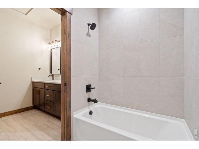 Property Photo 27 Tile shower and flooring