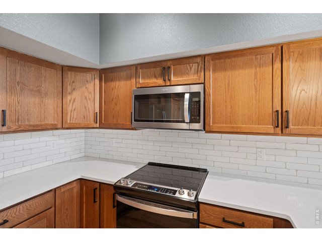 Property Photo 8 Quartz countertops and soft close cabinetry throughout