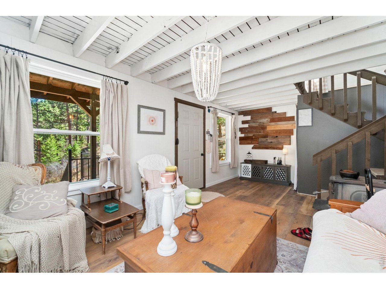 Bright and Comfortable Living Room with Cozy Wood Stove