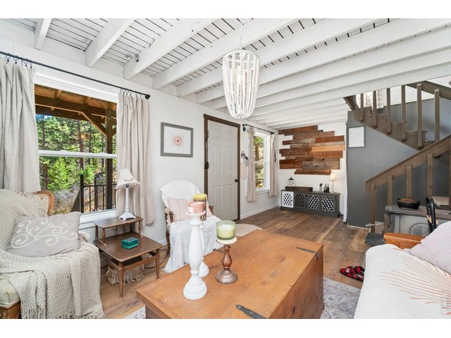 Property Photo 7 Bright and Comfortable Living Room with Cozy Wood Stove