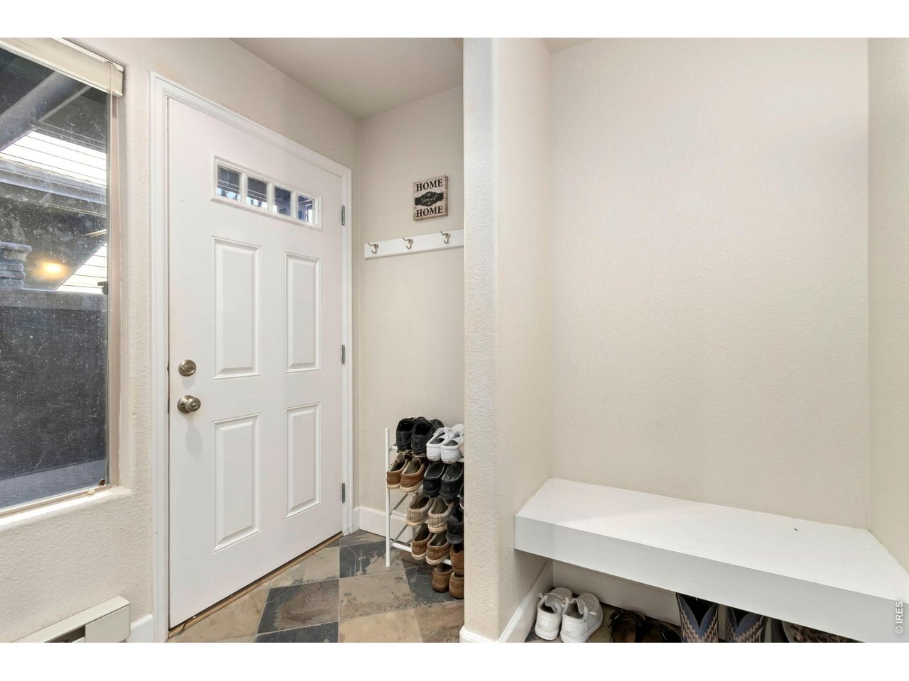 Entryway with bench and coat closet